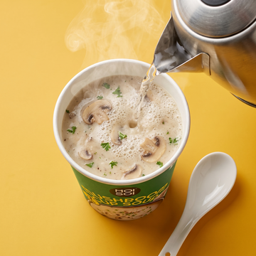 Hot water poured into a Mushroom Cup Soup